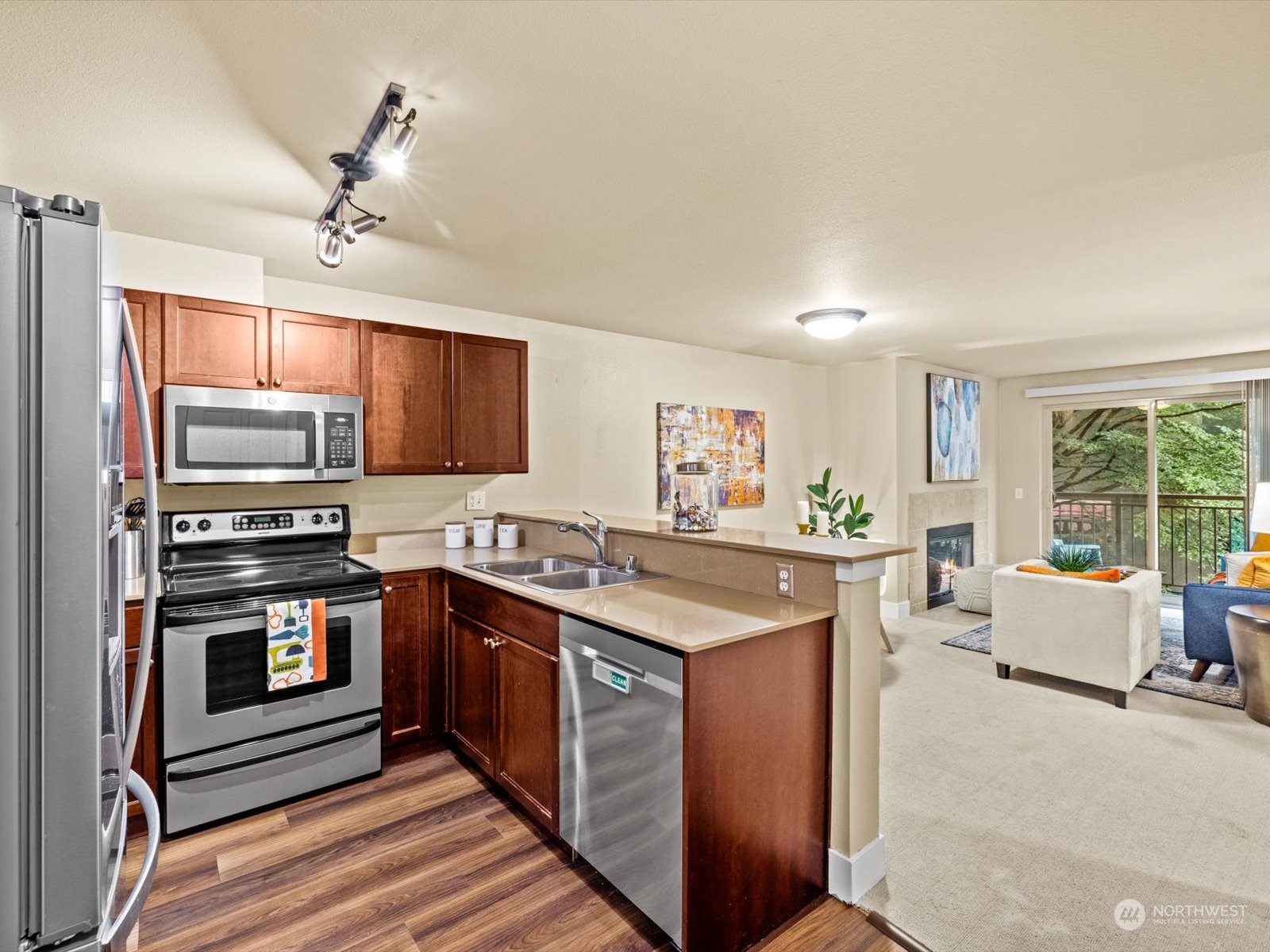a kitchen with stainless steel appliances granite countertop a stove and a sink