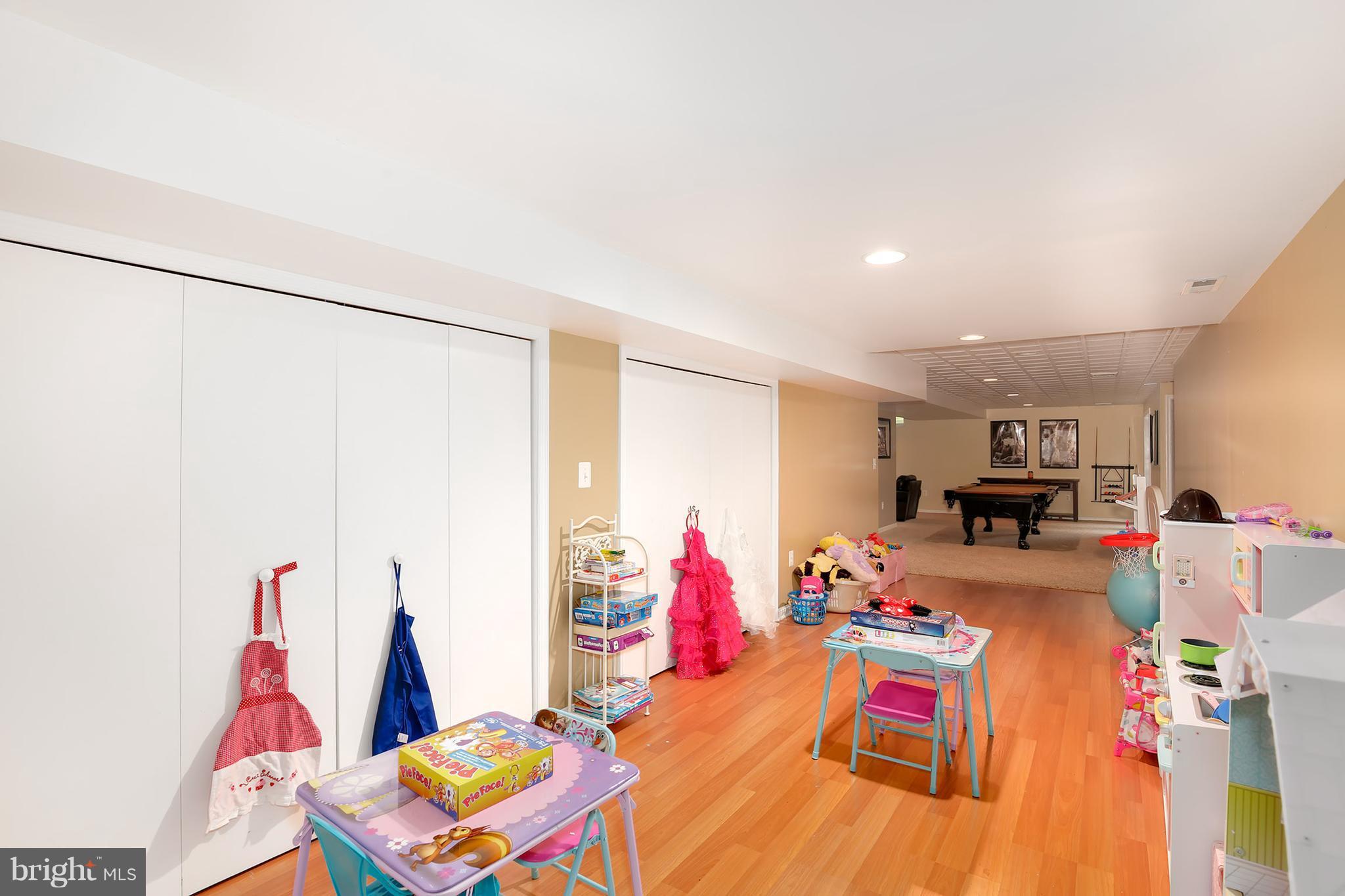 3 Brooks Court Baltimore, MD 21244 - Photo 21 of 30 a living room with furniture and a gym