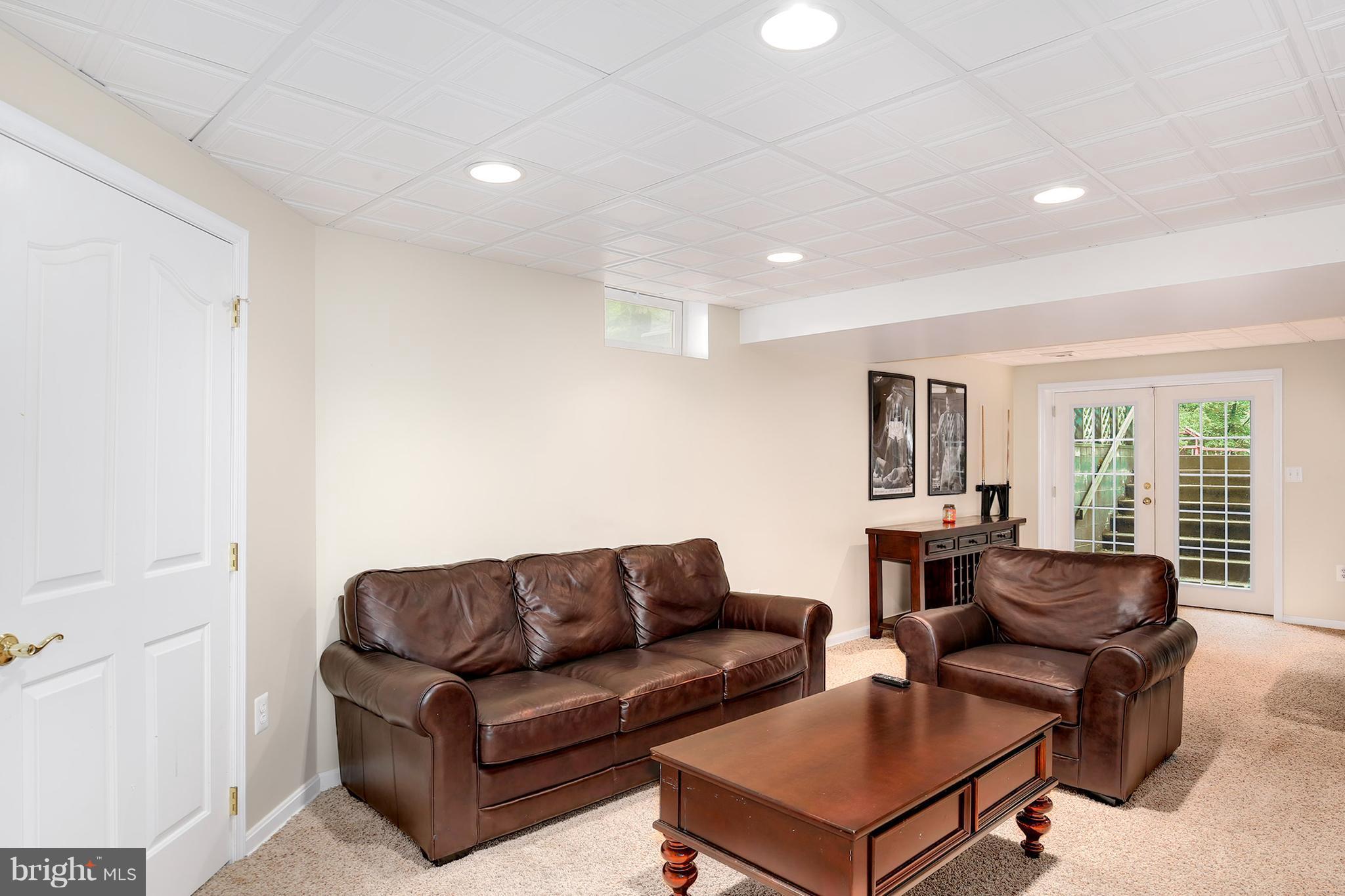 3 Brooks Court Baltimore, MD 21244 - Photo 22 of 30 a living room with furniture and large windows