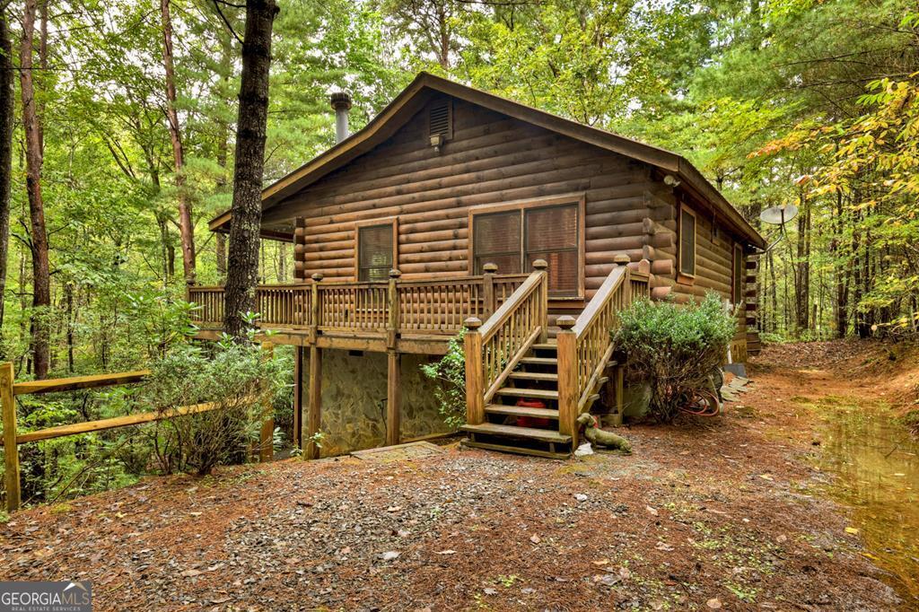 63 Posey Road Blue Ridge, GA 30513 - Photo 1 of 21 a front view of a house with a yard