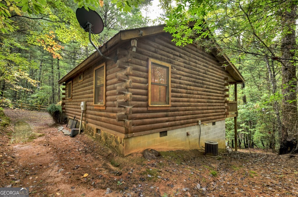 63 Posey Road Blue Ridge, GA 30513 - Photo 14 of 21 a front view of a house with a yard