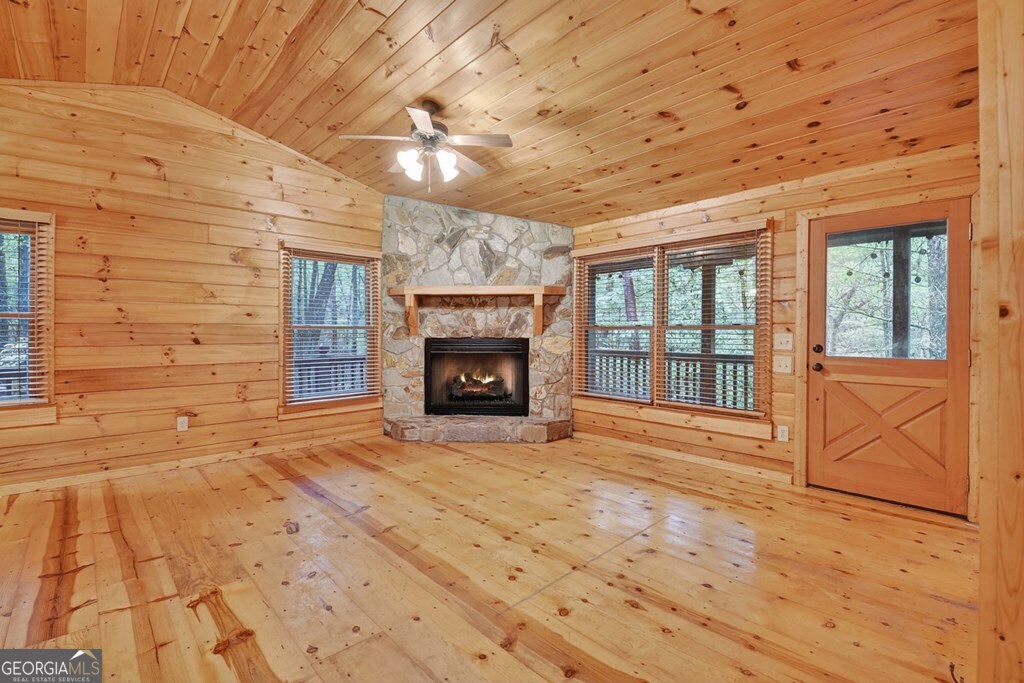 63 Posey Road Blue Ridge, GA 30513 - Photo 20 of 21 a view of an empty room with a fireplace