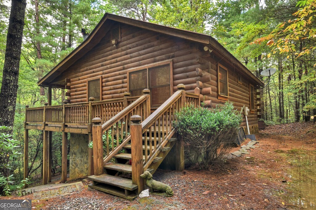 63 Posey Road Blue Ridge, GA 30513 - Photo 2 of 21 a front view of a house with a yard