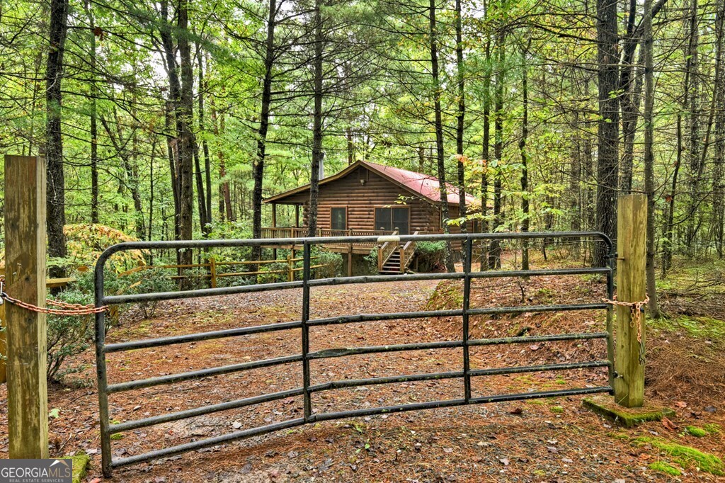 63 Posey Road Blue Ridge, GA 30513 - Photo 4 of 21 a view of a wooden fence and trees