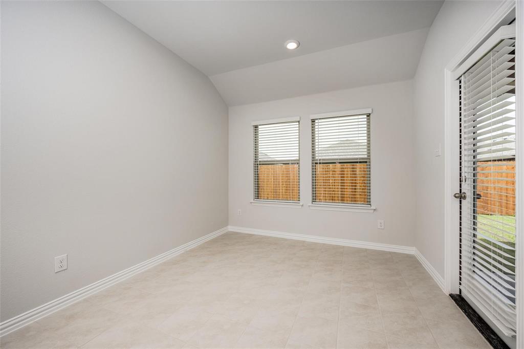 5113 Unity Drive Denton, TX 76207 - Photo 15 of 22 an empty room with windows