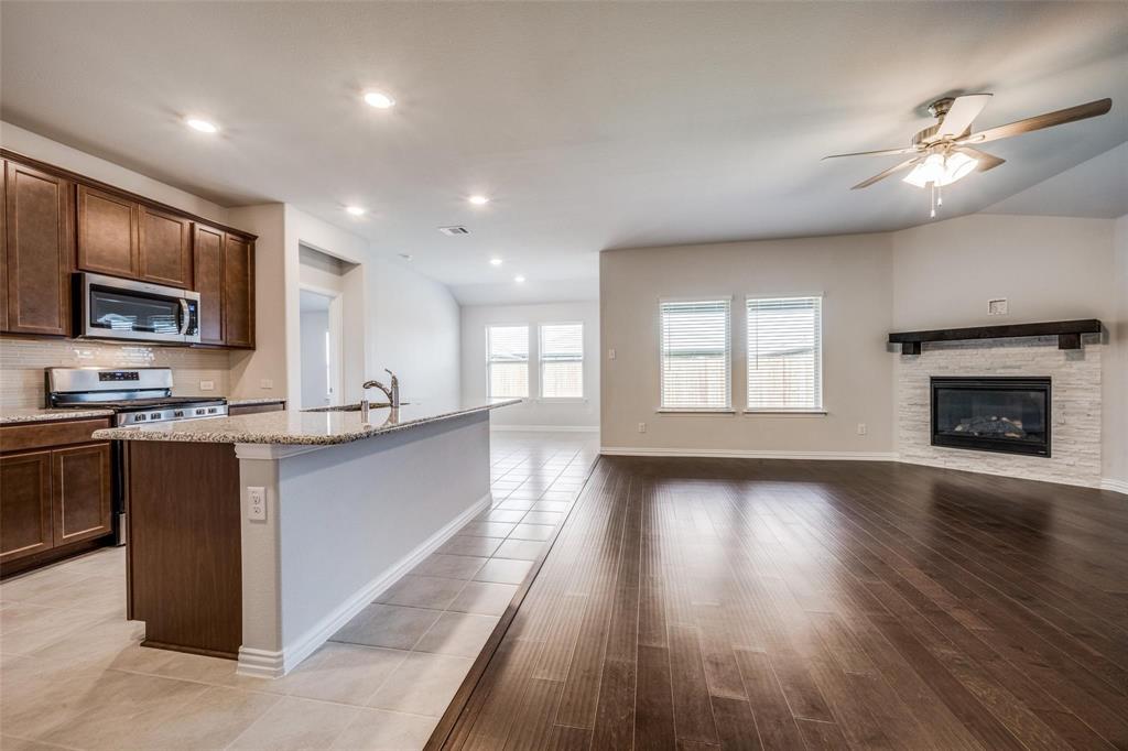 5113 Unity Drive Denton, TX 76207 - Photo 9 of 22 a view of kitchen with sink and microwave