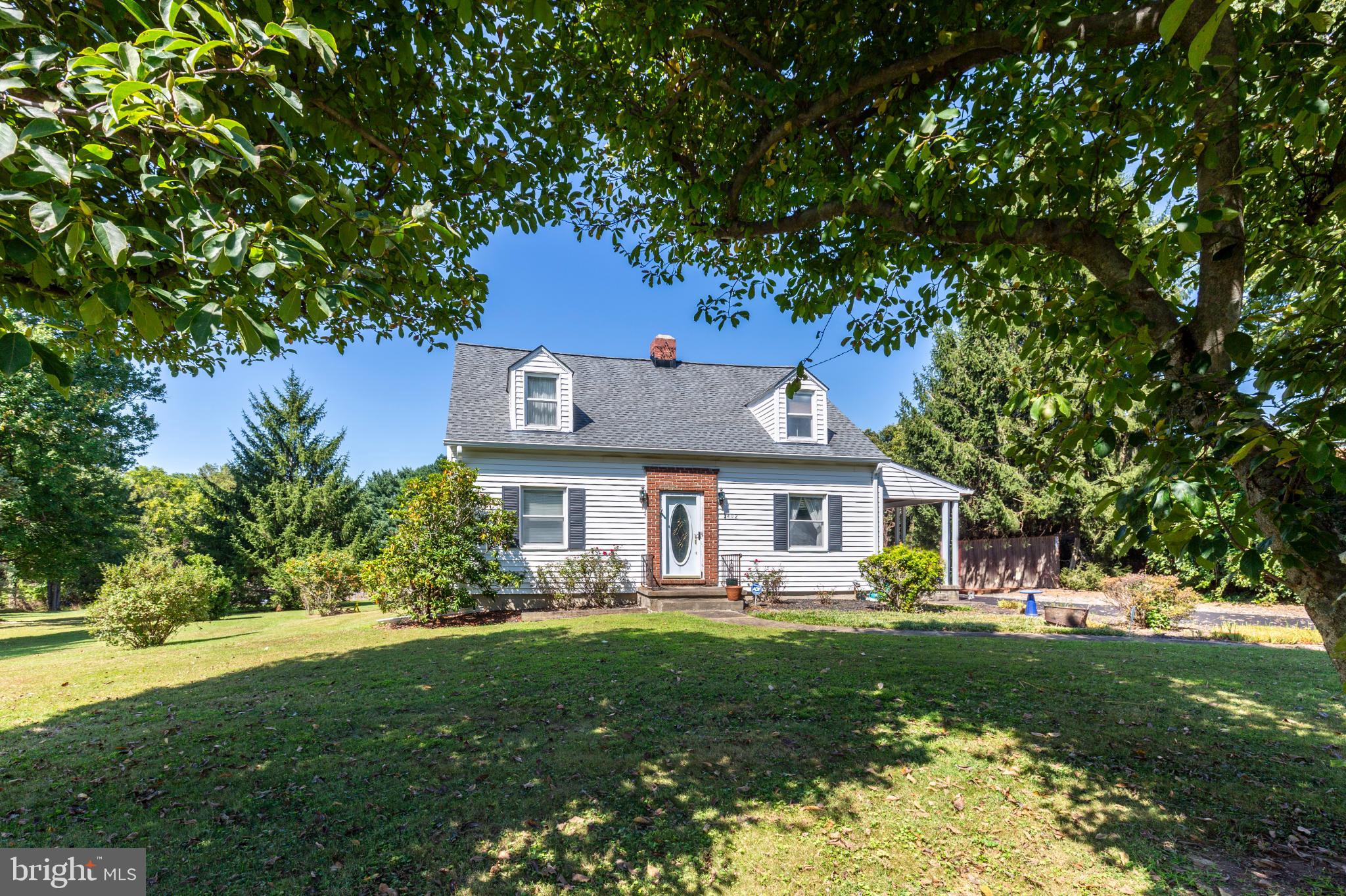 3402 Offutt Road Randallstown, MD 21133 - Photo 1 of 63 a front view of a house with a yard