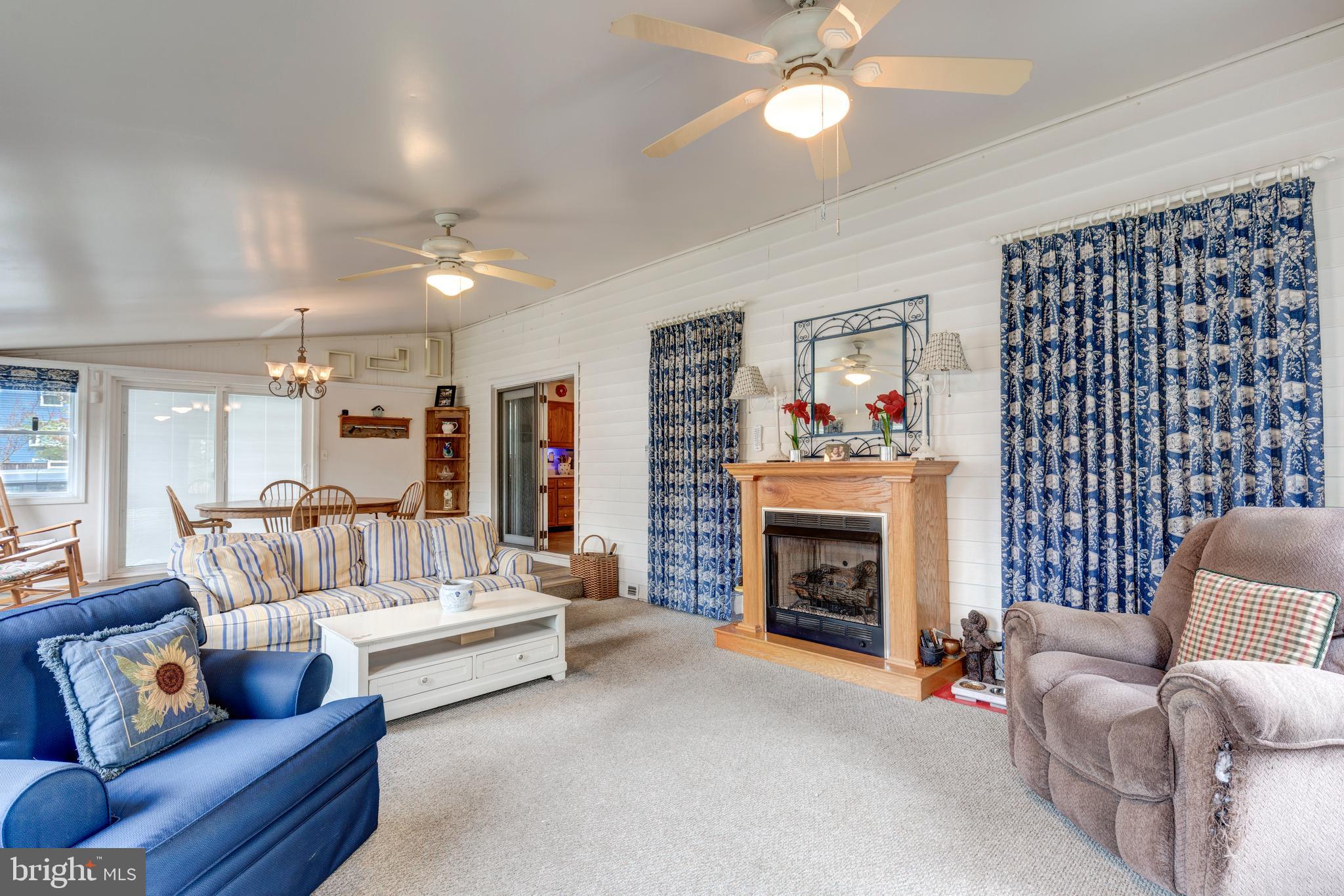 3402 Offutt Road Randallstown, MD 21133 - Photo 12 of 63 a living room with furniture and a fireplace