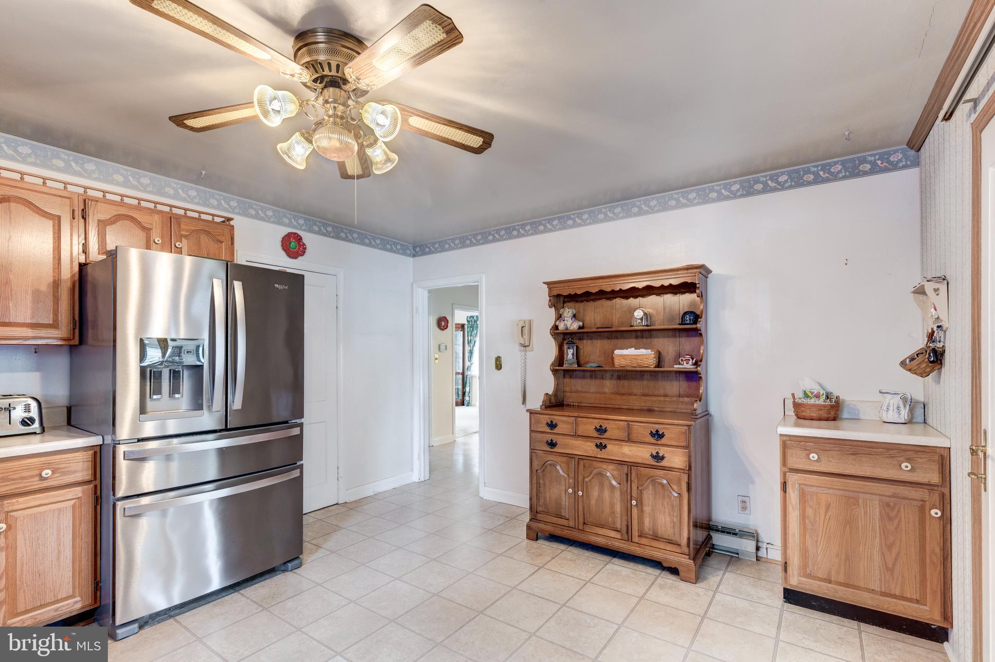 3402 Offutt Road Randallstown, MD 21133 - Photo 20 of 63 a kitchen with stainless steel appliances a stove and a refrigerator