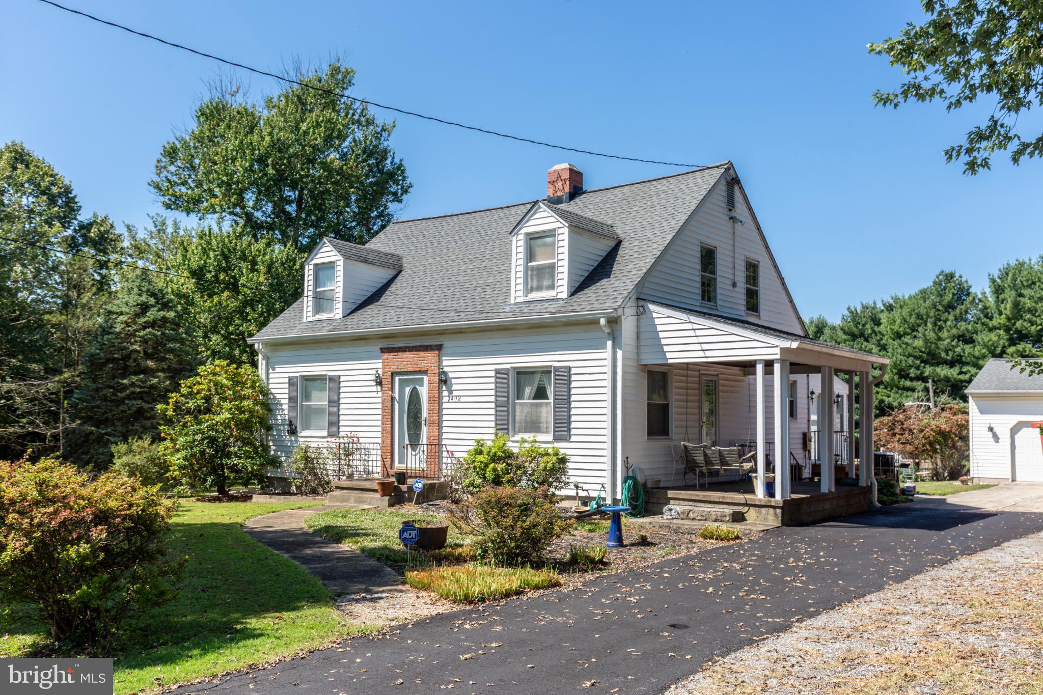3402 Offutt Road Randallstown, MD 21133 - Photo 2 of 63 a front view of a house with garden