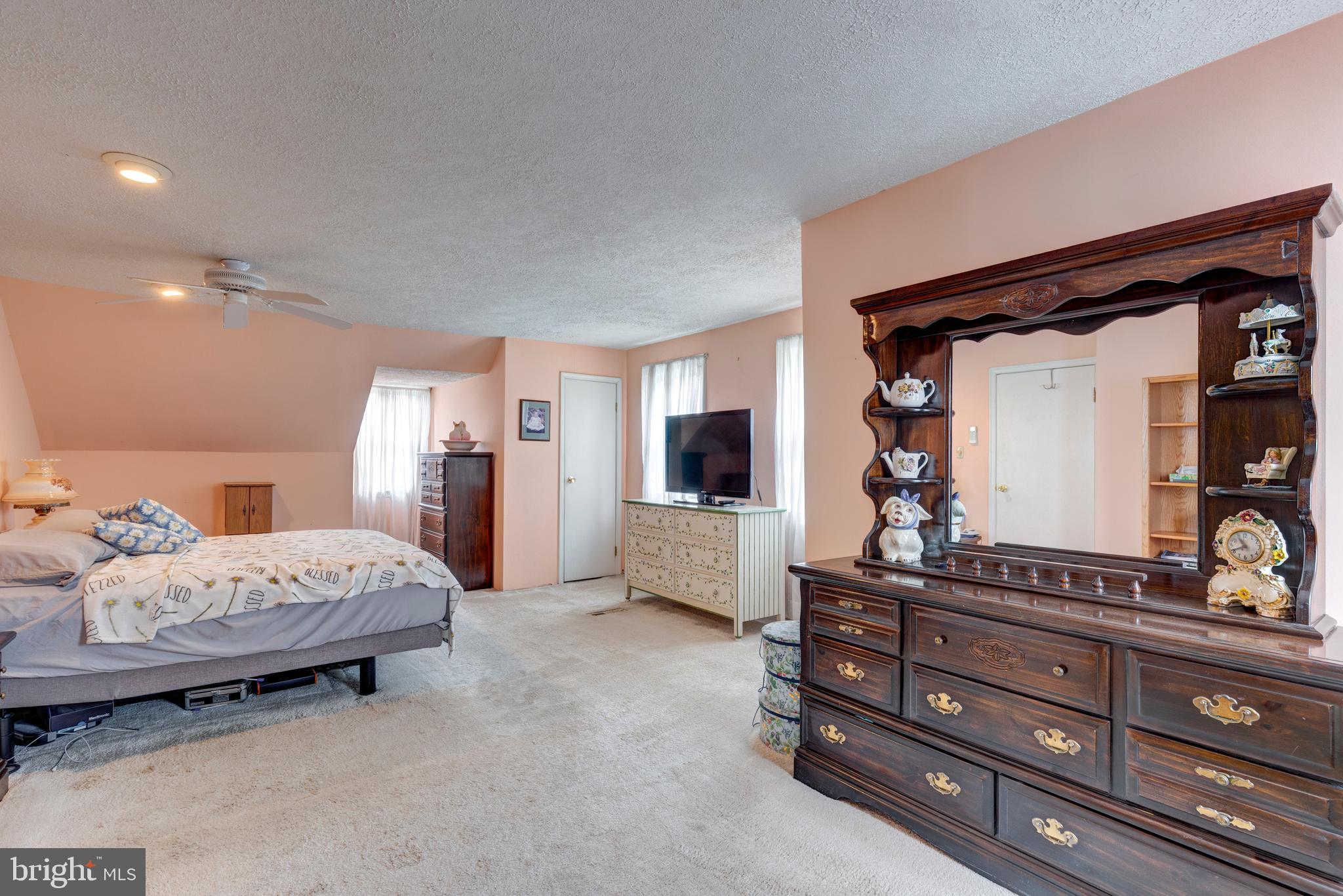 3402 Offutt Road Randallstown, MD 21133 - Photo 25 of 63 a bedroom with a bed and a dresser