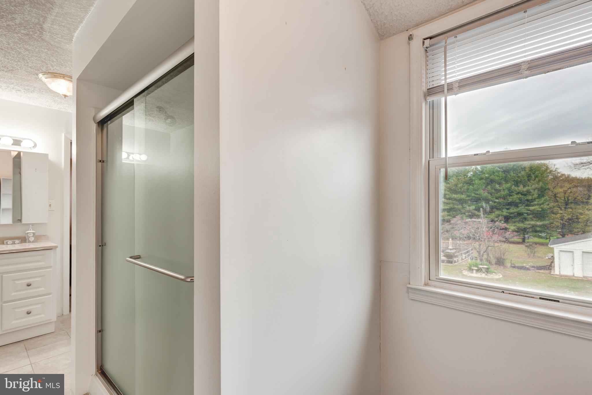 3402 Offutt Road Randallstown, MD 21133 - Photo 31 of 63 a view of a glass door and a window