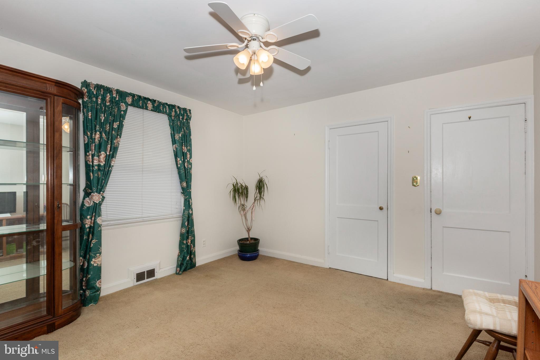 3402 Offutt Road Randallstown, MD 21133 - Photo 32 of 63 a bedroom with a bed and a chandelier