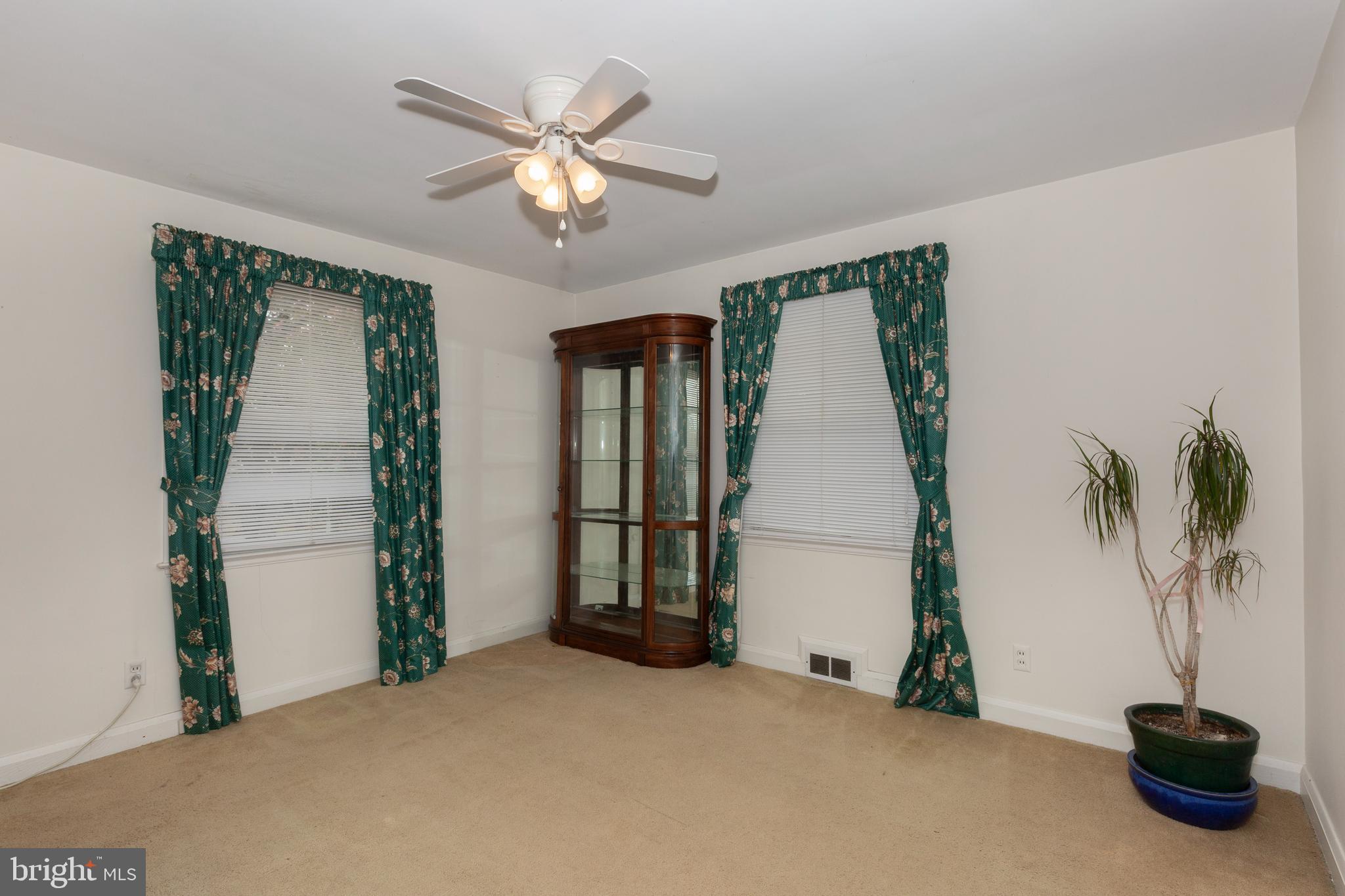 3402 Offutt Road Randallstown, MD 21133 - Photo 33 of 63 a view of a livingroom with a potted plant and a window