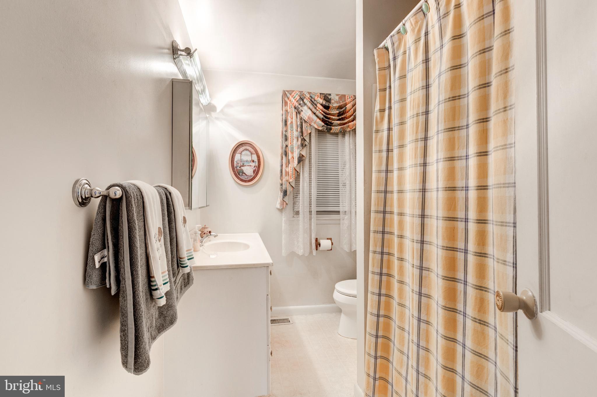 3402 Offutt Road Randallstown, MD 21133 - Photo 36 of 63 a bathroom with a shower and a sink