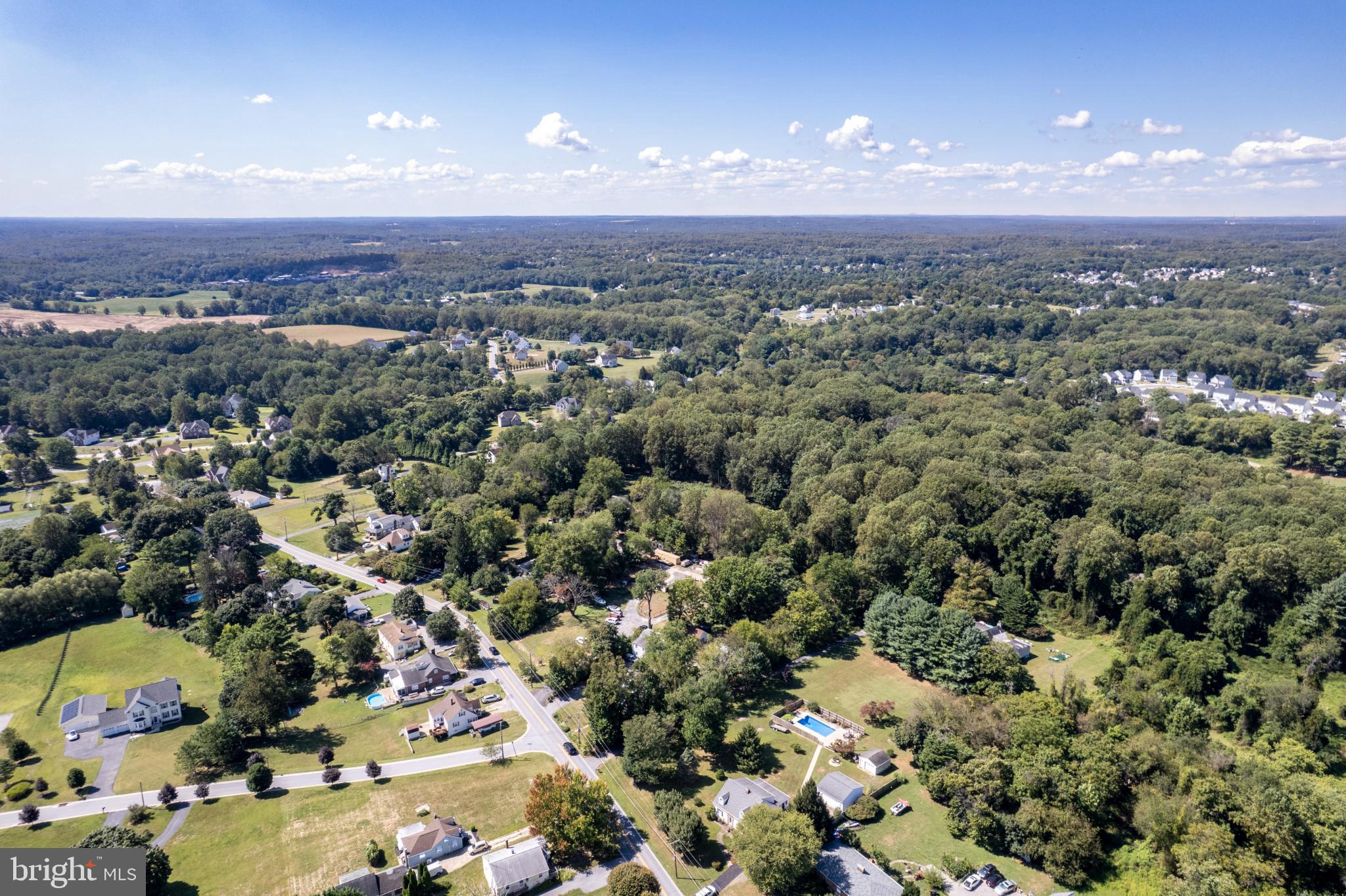 3402 Offutt Road Randallstown, MD 21133 - Photo 45 of 63 Serene suburban landscape under blue skies.