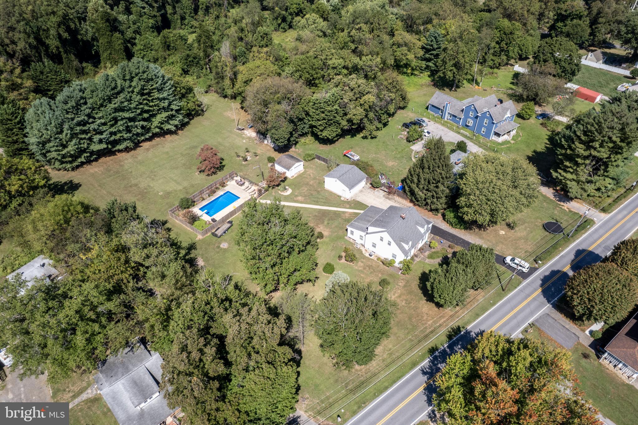 3402 Offutt Road Randallstown, MD 21133 - Photo 46 of 63 Sprawling estate with lush greenery and pool.