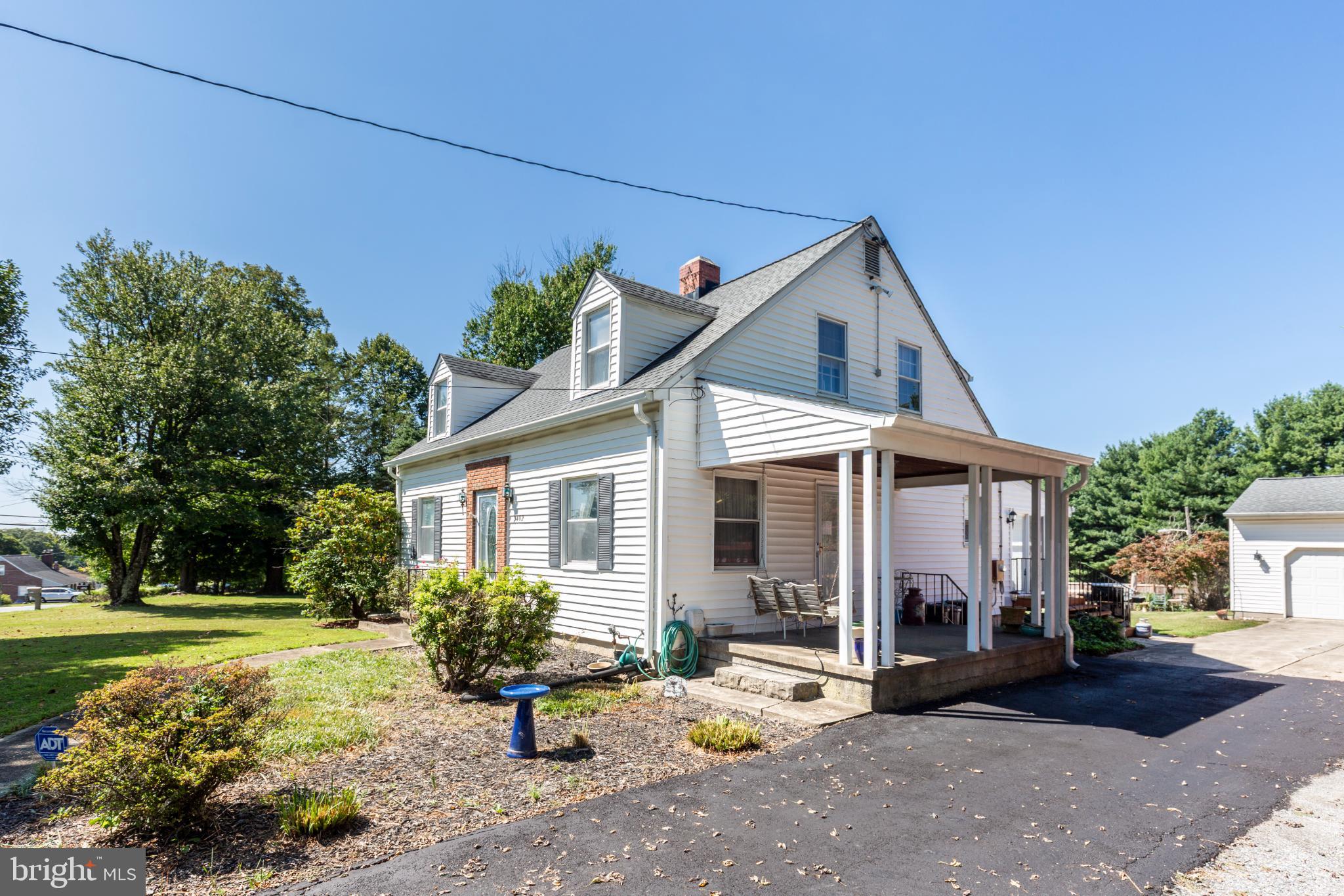 3402 Offutt Road Randallstown, MD 21133 - Photo 5 of 63 a front view of a house with garden