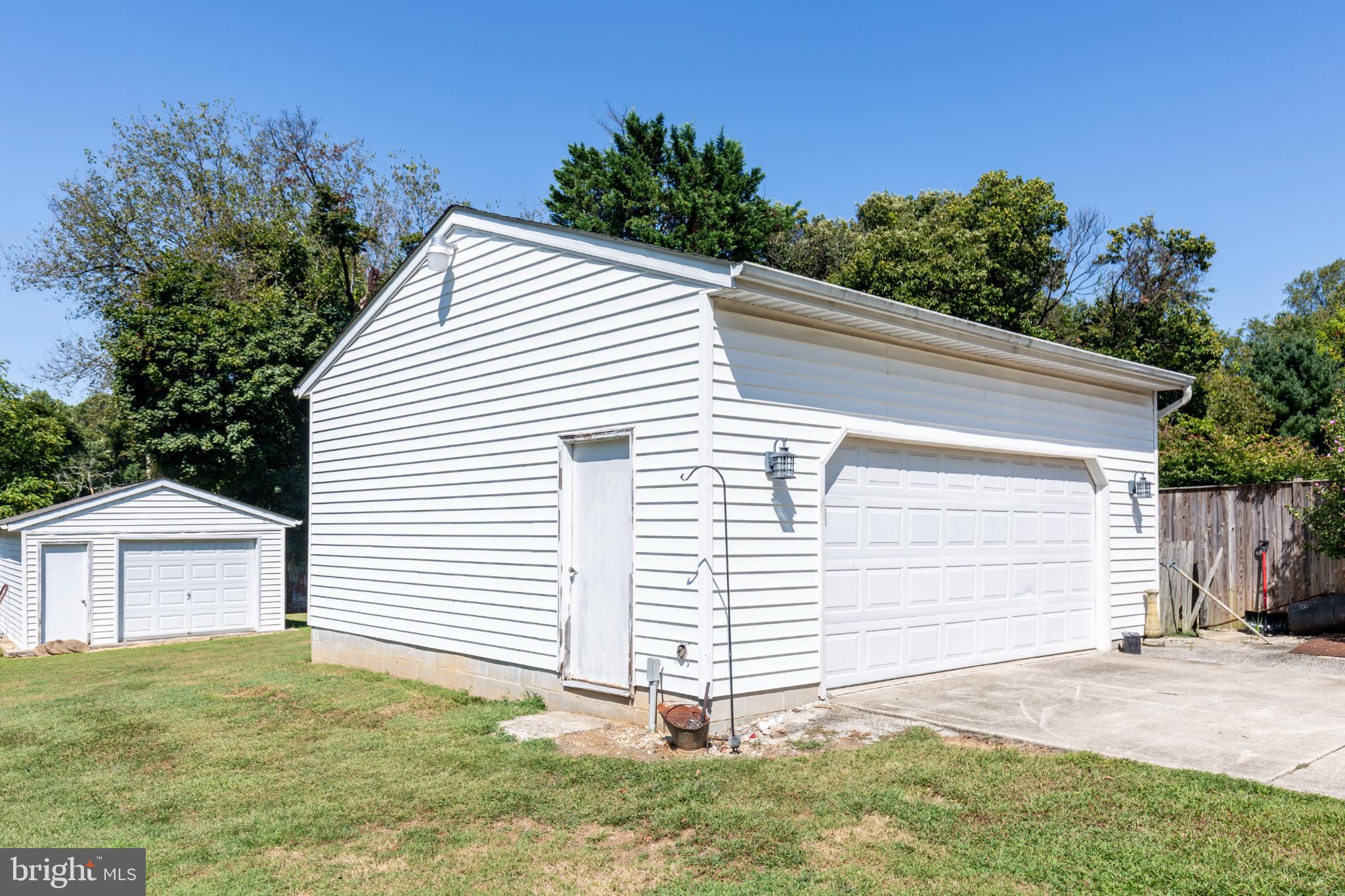 3402 Offutt Road Randallstown, MD 21133 - Photo 56 of 63 a view of a house with a yard and garage