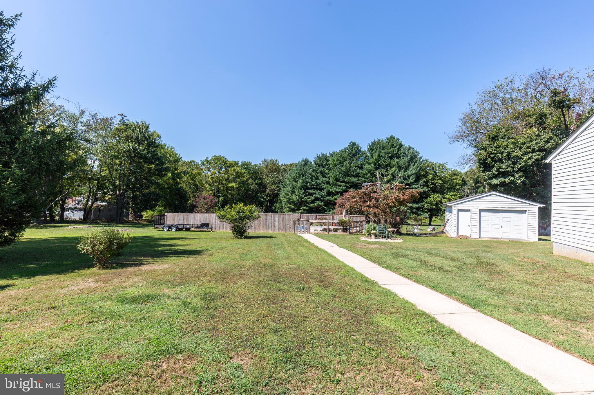 3402 Offutt Road Randallstown, MD 21133 - Photo 57 of 63 Spacious yard with lush greenery and trees.