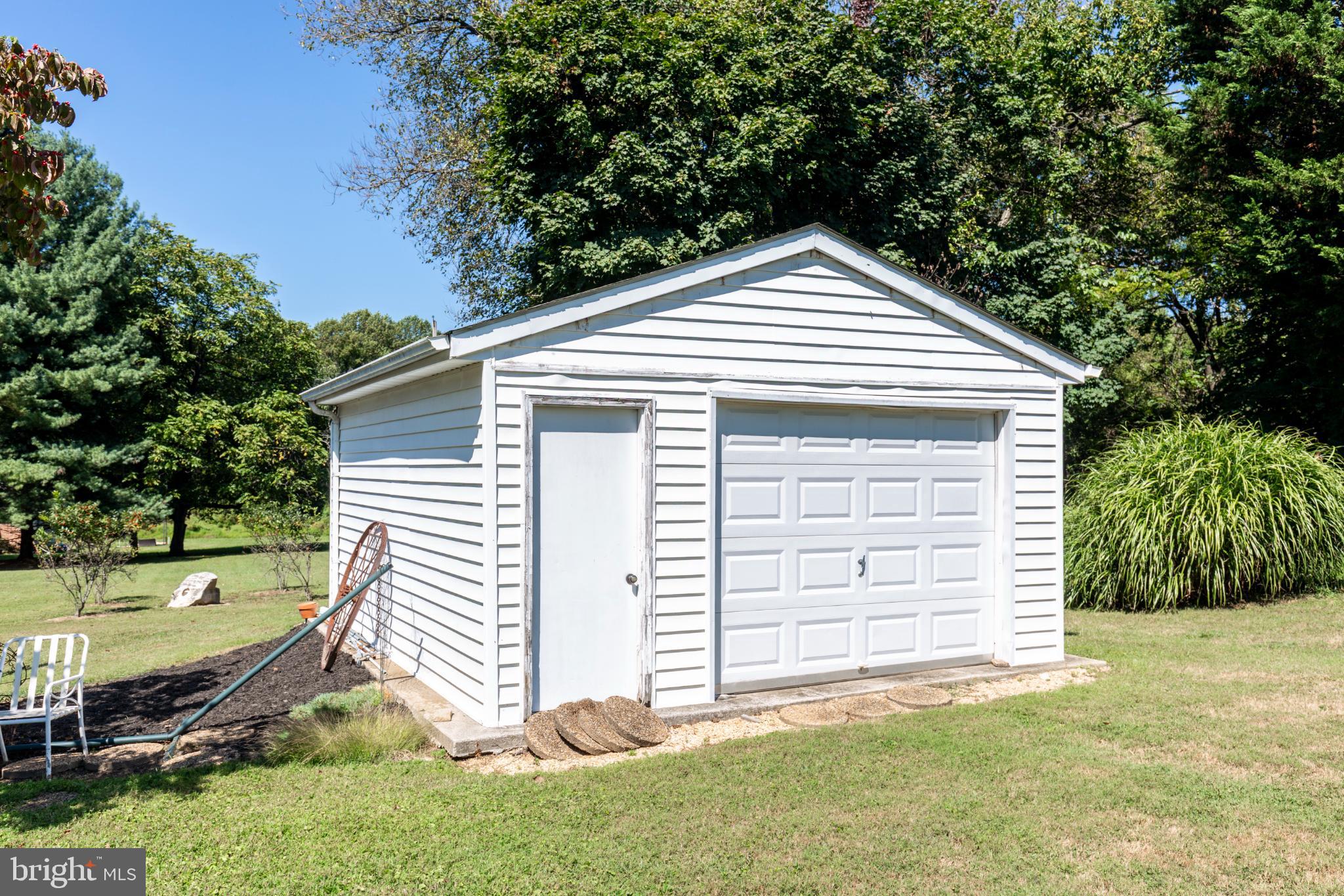 3402 Offutt Road Randallstown, MD 21133 - Photo 58 of 63 a front view of a house with a yard