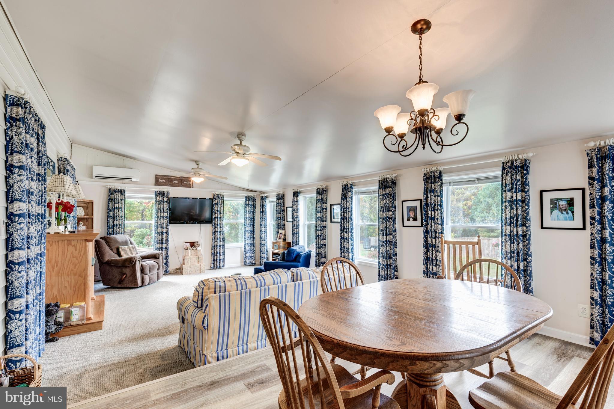 3402 Offutt Road Randallstown, MD 21133 - Photo 10 of 63 a view of a dining room with furniture wooden floor and chandelier