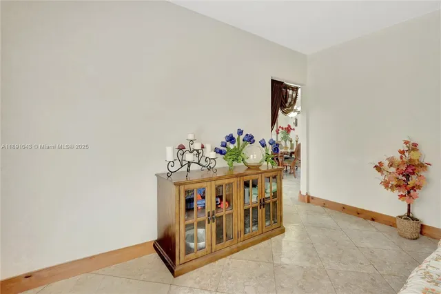 a white bed with white walls