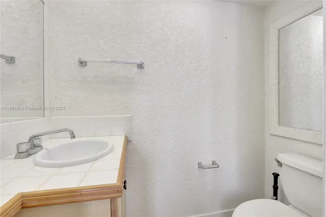 a bathroom with a sink and a toilet
