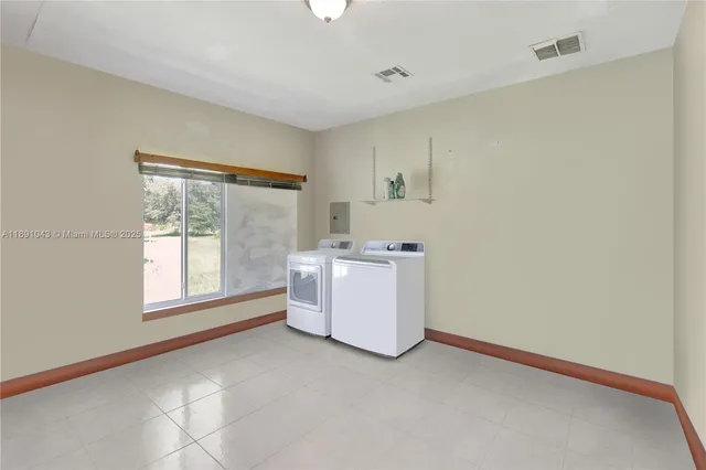 a view of a room with window and washer