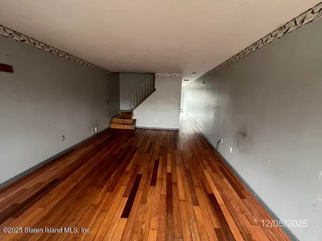 a view of outdoor space with wooden floor