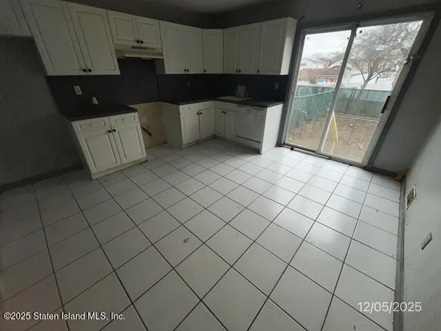 a kitchen with a sink and cabinets