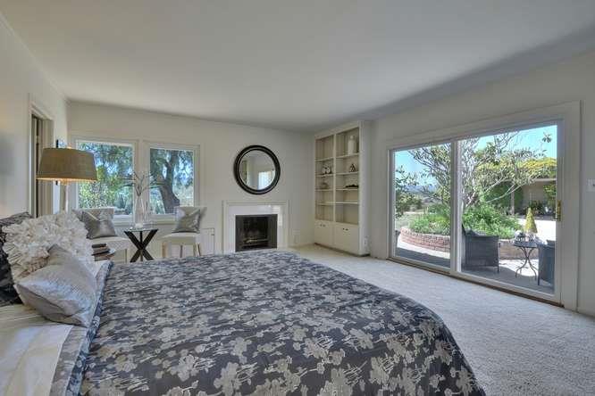 26140 Robb Road Palo Alto, CA 94306 - Photo 25 of 28 a living room with furniture a fireplace and a large window