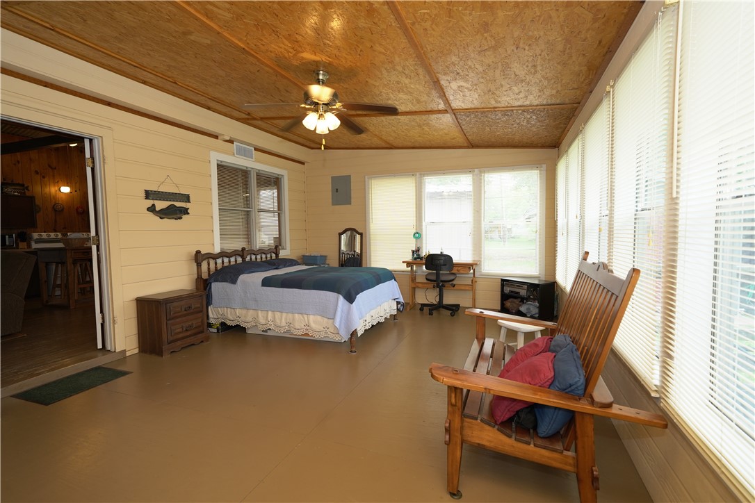 24857 Lakeview (cr 360) Mathis, TX 78368 - Photo 15 of 31 a bedroom with furniture and a large window