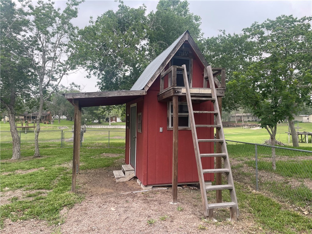 24857 Lakeview (cr 360) Mathis, TX 78368 - Photo 21 of 31 a view of backyard of house and trees