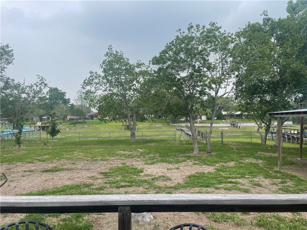 24857 Lakeview (cr 360) Mathis, TX 78368 - Photo 31 of 31 a view of a wooden floor and a yard