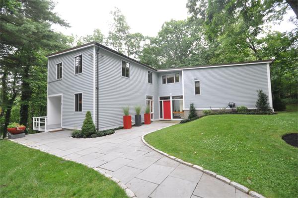 21 Moon Hill Road Lexington, MA 02421 - Photo 1 of 17 a view of a house with a yard and lawn chairs