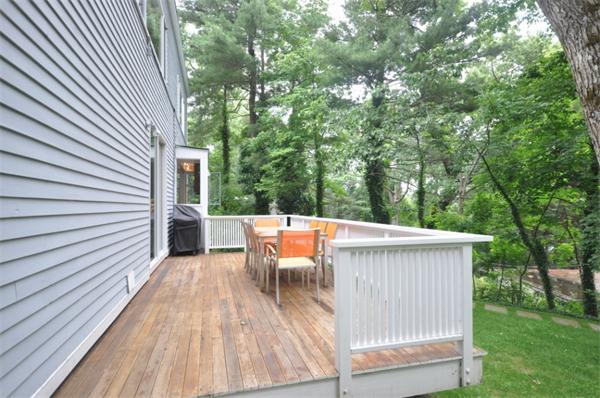 21 Moon Hill Road Lexington, MA 02421 - Photo 17 of 17 a view of a patio with table and chairs with wooden floor and fence