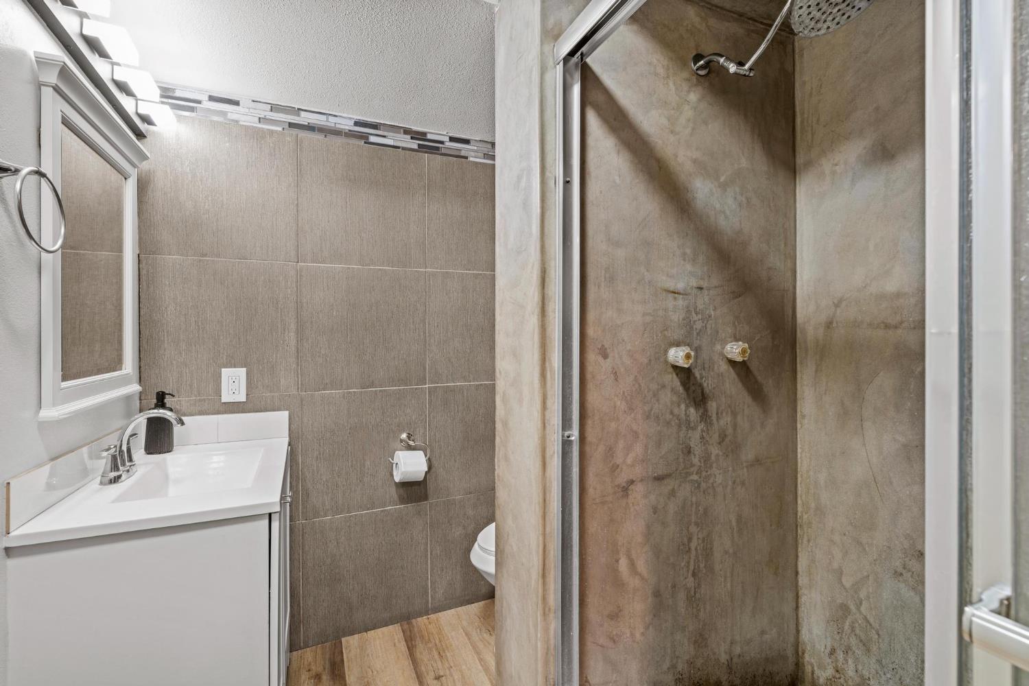 1432 Page Court Modesto, CA 95354 - Photo 16 of 62 a bathroom with a shower and a sink