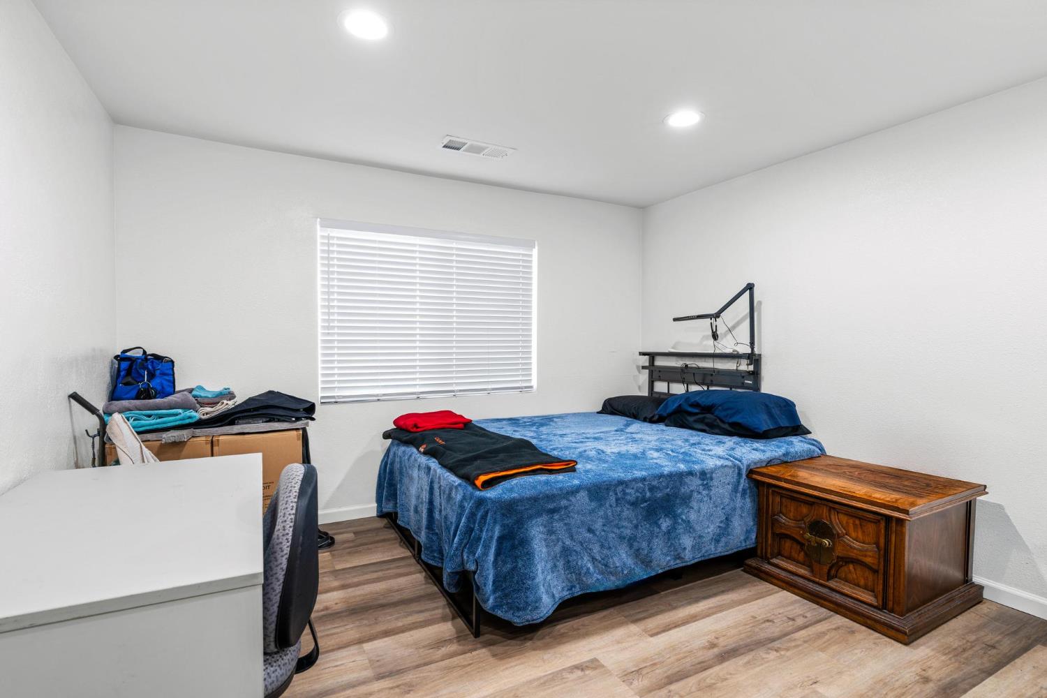 1432 Page Court Modesto, CA 95354 - Photo 17 of 62 a bedroom with a bed and a window
