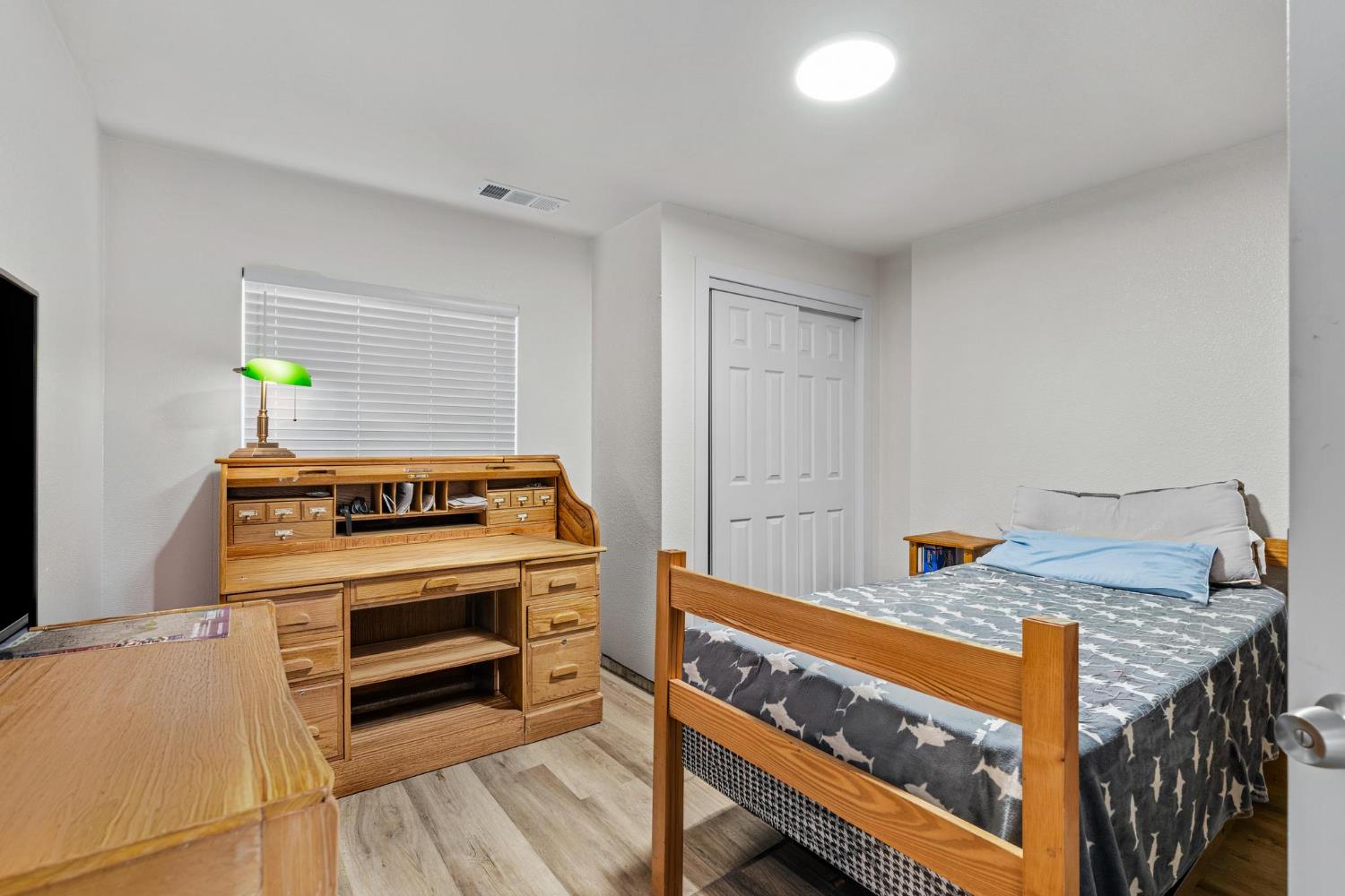 1432 Page Court Modesto, CA 95354 - Photo 19 of 62 a bed room with a bed and a window