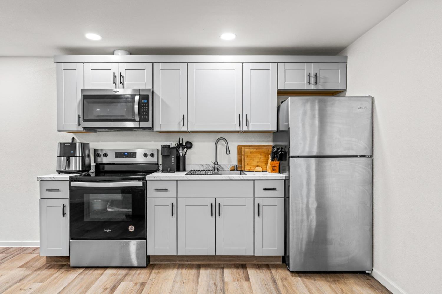 1432 Page Court Modesto, CA 95354 - Photo 25 of 62 a kitchen with stainless steel appliances granite countertop a refrigerator sink and stove
