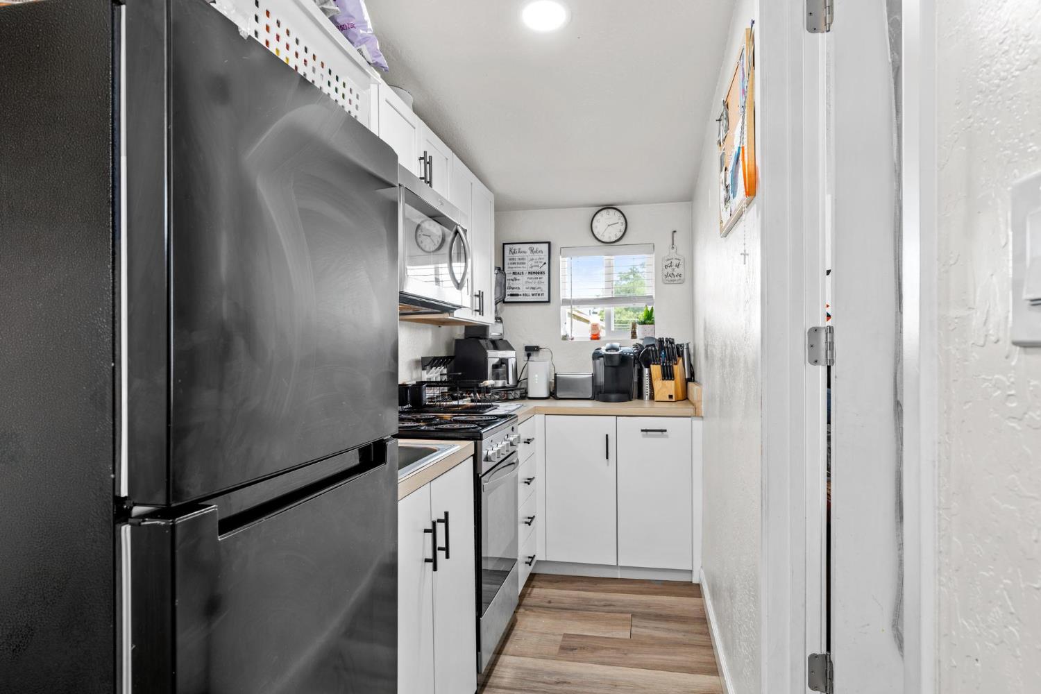 1432 Page Court Modesto, CA 95354 - Photo 36 of 62 a kitchen with stainless steel appliances a refrigerator and a stove