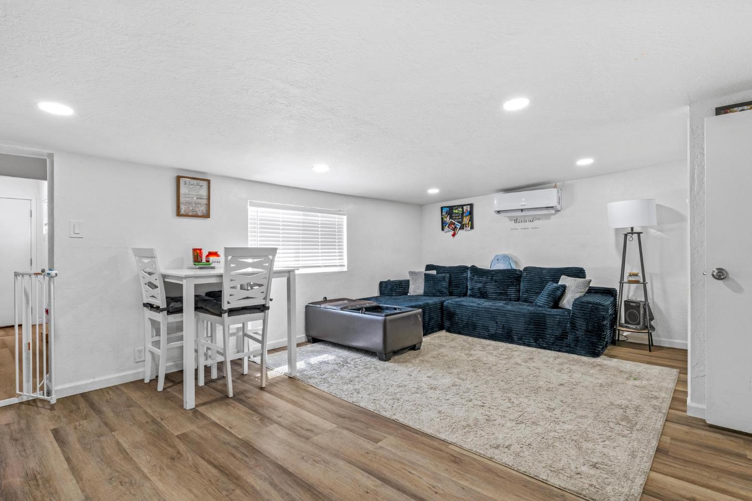 1432 Page Court Modesto, CA 95354 - Photo 39 of 62 a living room with furniture and a wooden floor