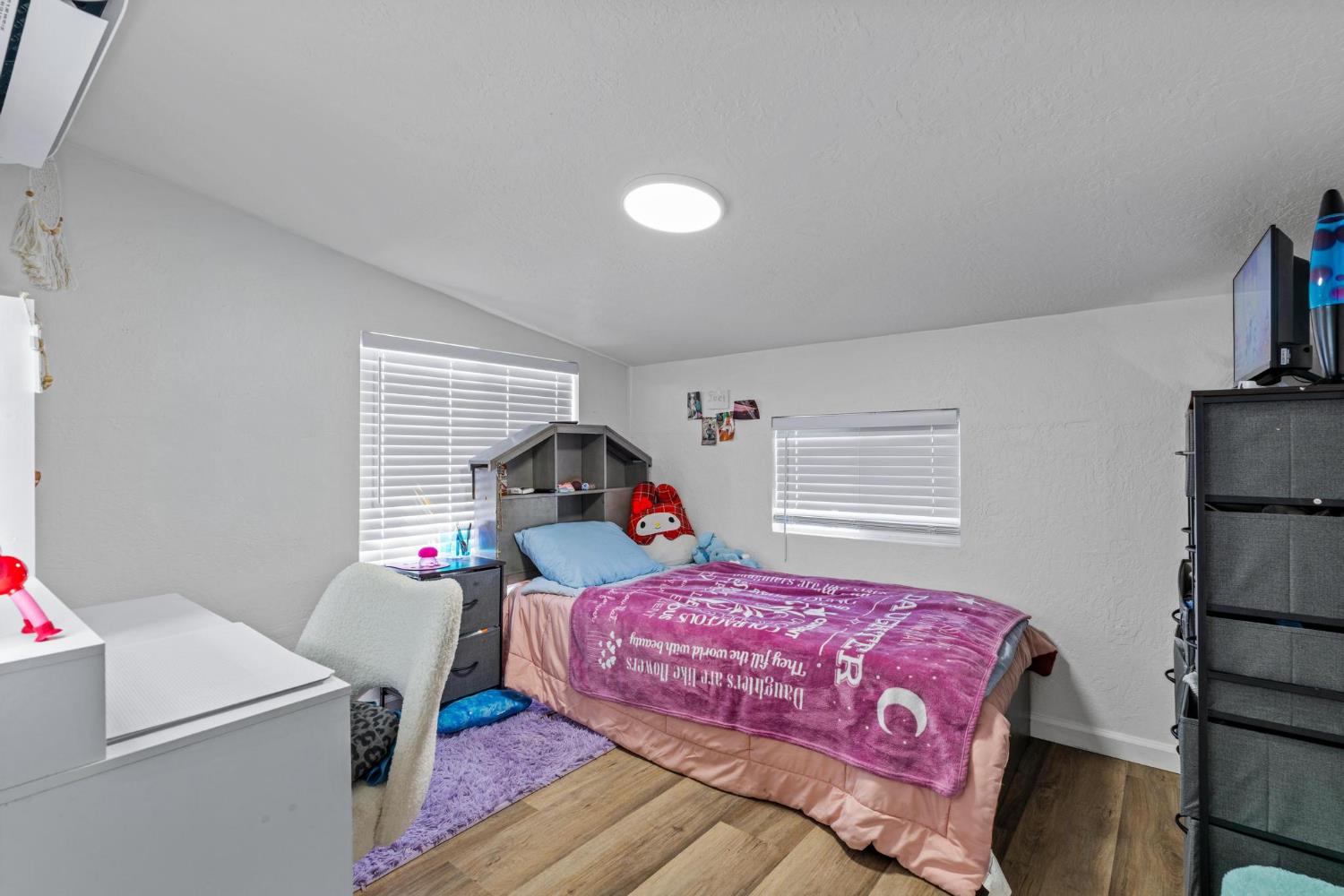1432 Page Court Modesto, CA 95354 - Photo 44 of 62 a bedroom with a bed and a window