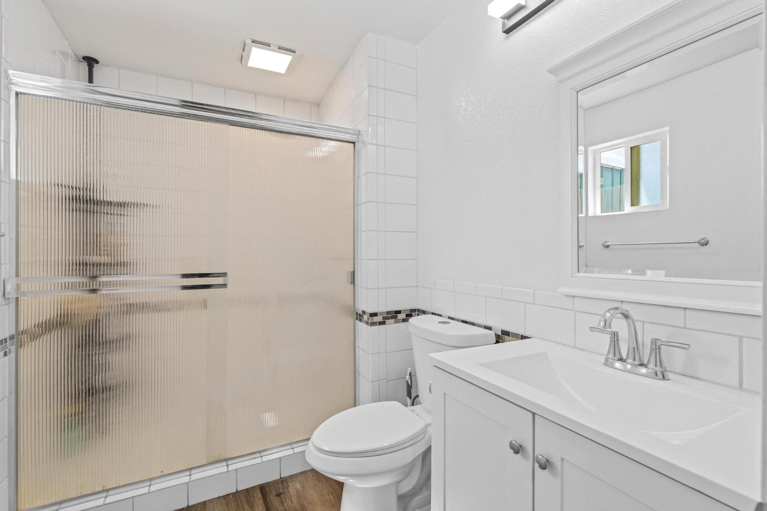 1432 Page Court Modesto, CA 95354 - Photo 47 of 62 a bathroom with a sink a toilet and shower