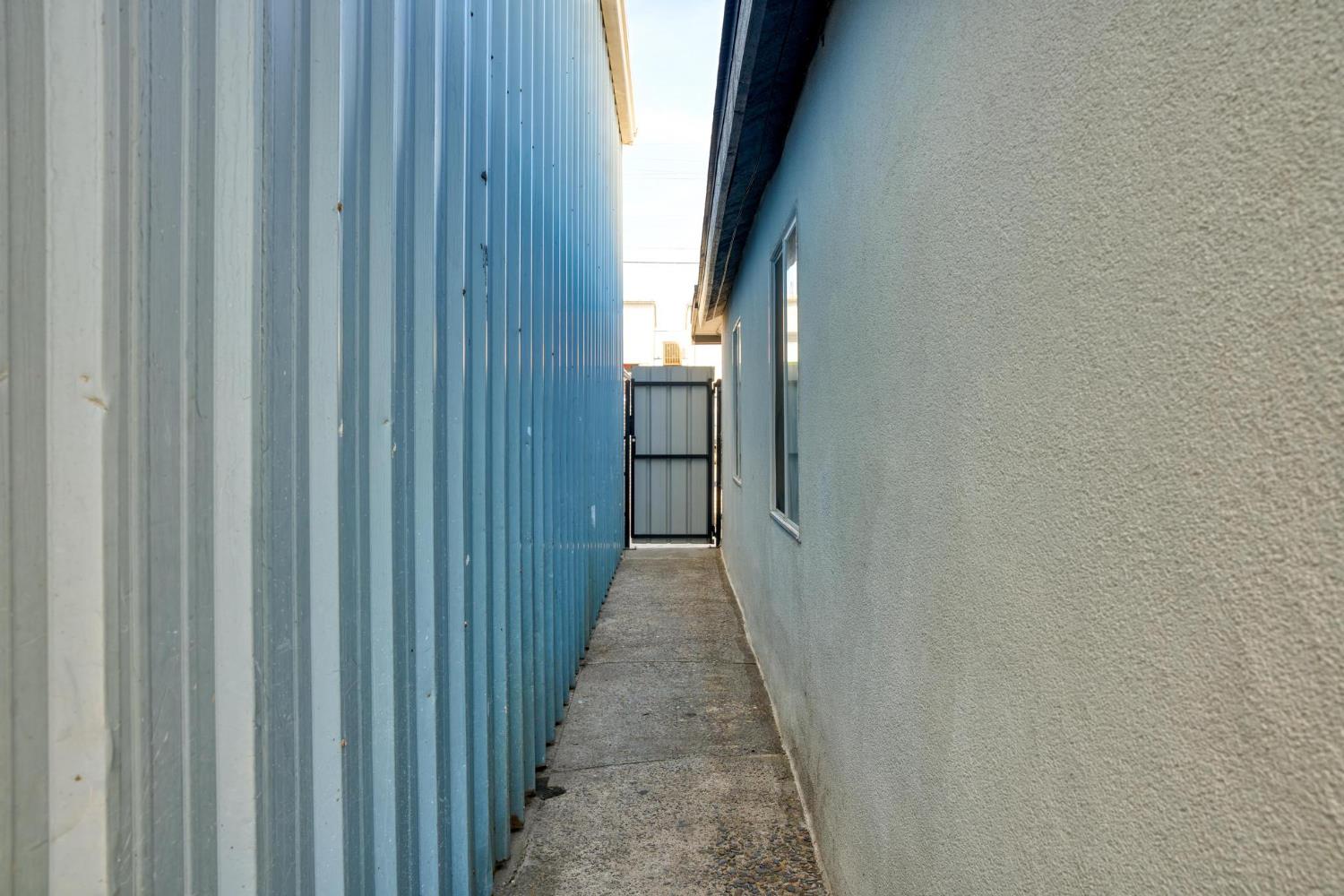 1432 Page Court Modesto, CA 95354 - Photo 58 of 62 a view of a pathway and a wooden door