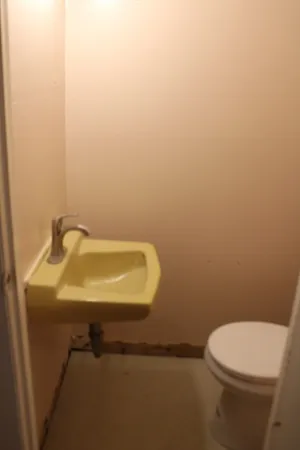 a backyard of a house with outdoor seating