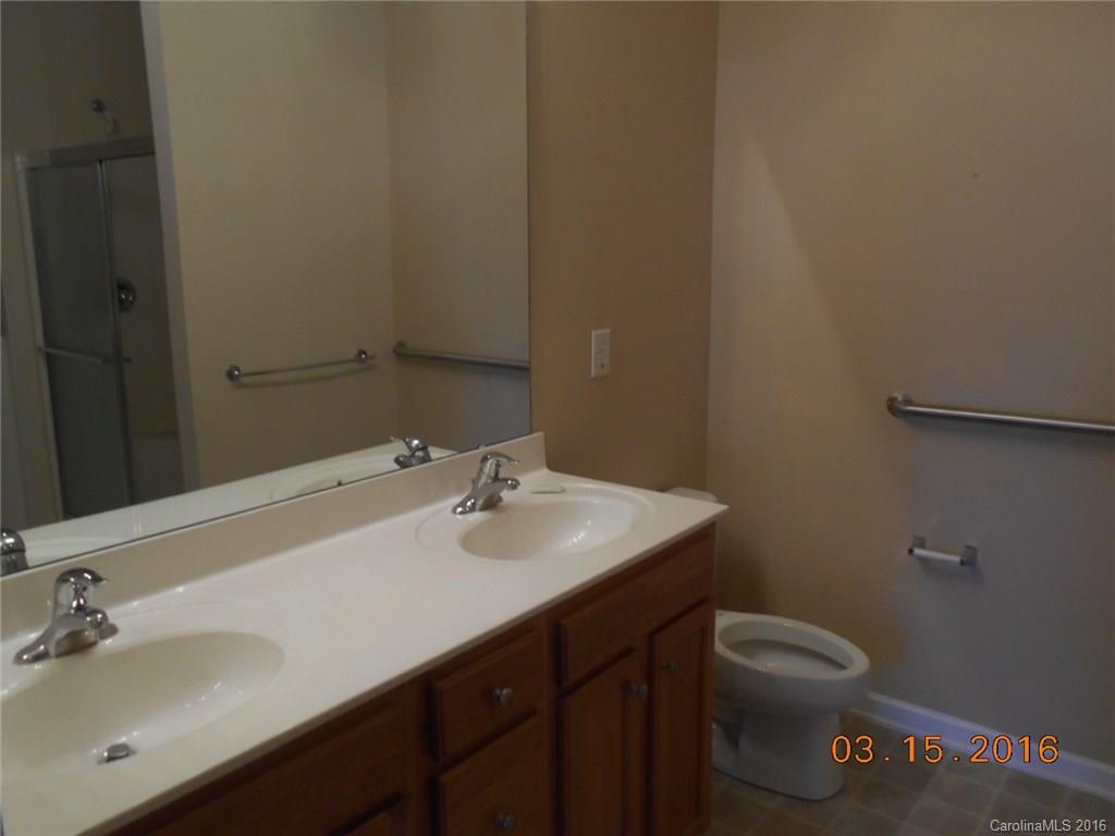 294 Garnet Court, Unit 520 Fort Mill, SC 29708 - Photo 11 of 13 a bathroom with a sink toilet and vanity