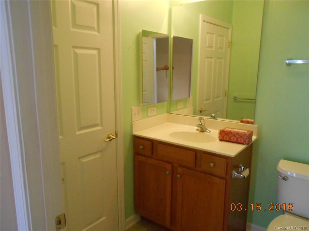 294 Garnet Court, Unit 520 Fort Mill, SC 29708 - Photo 13 of 13 a bathroom with a sink and a mirror