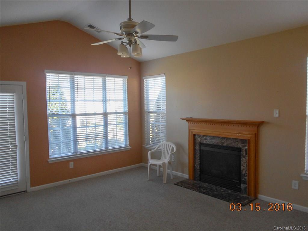 294 Garnet Court, Unit 520 Fort Mill, SC 29708 - Photo 5 of 13 a view of an empty room with a fireplace